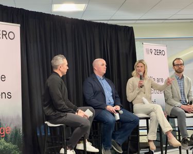 Andrea Woodside speaks on a panel