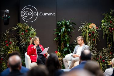 A man and womean speaking.