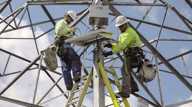 Workers on a power tower