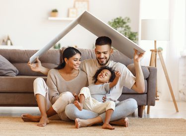 A family smiling in a home