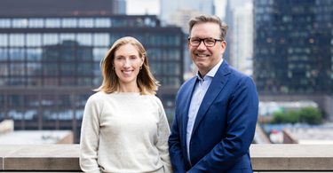 A woman and man smiling