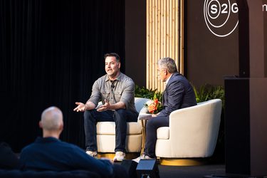 Men Speaking on Stage