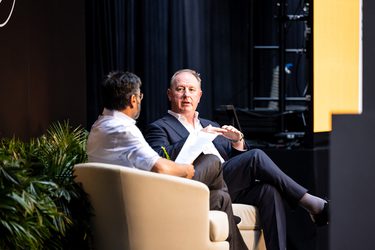 Men Speaking on Stage