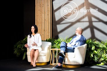 A woman talking on stage