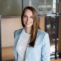 A woman smiling.Lauren Collins.